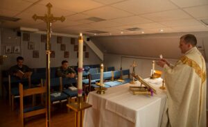 chaplain-lt-curtiss-dwyer-a-catholic-priest-aboard-the-aircraft-carrier-uss-33d3b8-1024