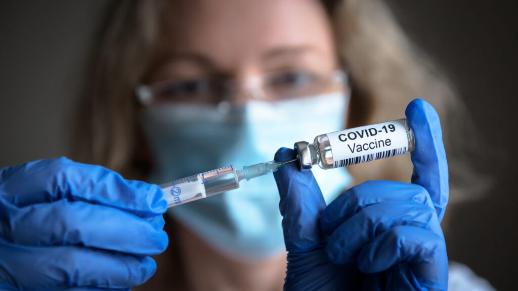 Covid-19,Vaccine,In,Researcher,Hands,,Female,Doctor’s,Holds,Syringe,And