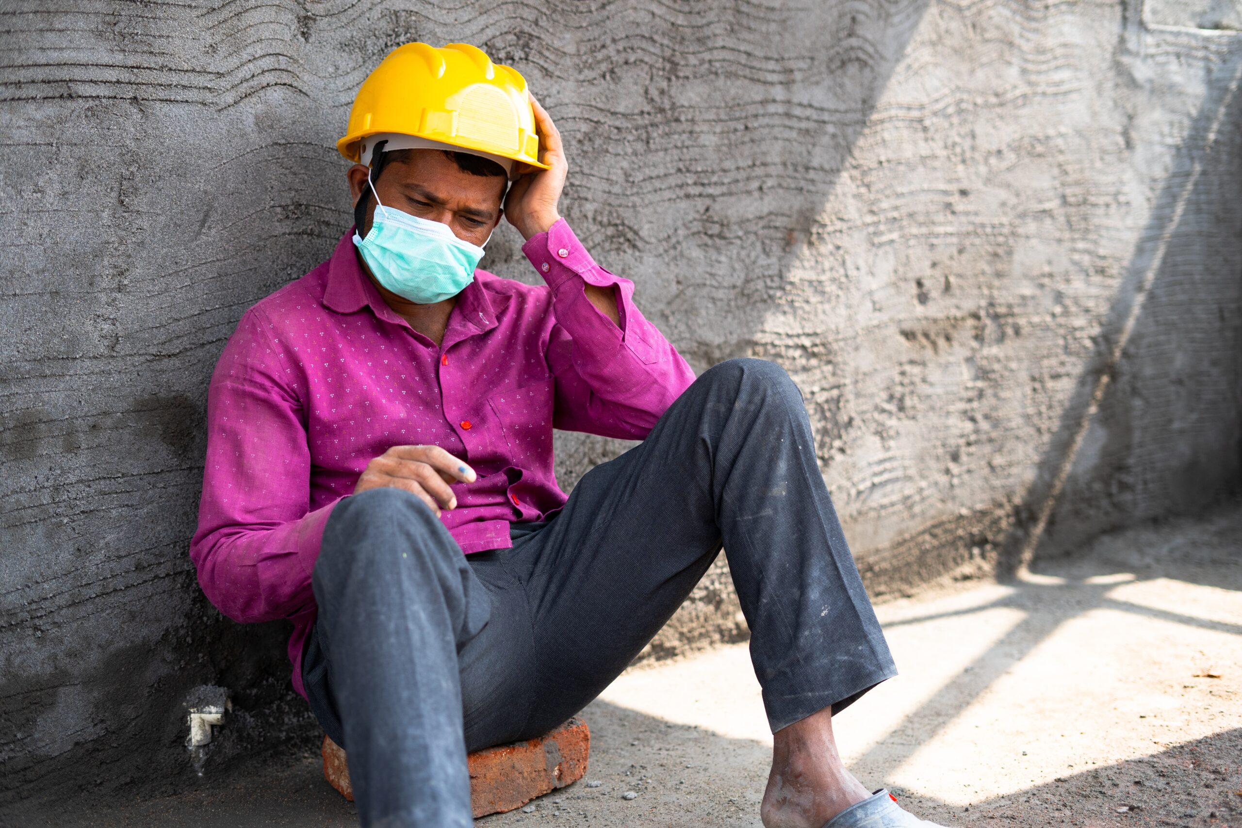 Hand,Held,Pan,Shot,Of,Worried,Construction,Labour,With,Medical