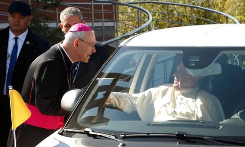 Auxiliary Bishop Athanasius Schneider of Astana, Kazakhstan, greets Pope Francis in his car after a meeting with bishops, priests, deacons, consecrated persons, seminarians and pastoral workers at the cathedral of Our Lady of Perpetual Help in Nur-Sultan, Kazakhstan, Sept. 15, 2022. (CNS photo/Paul Haring)