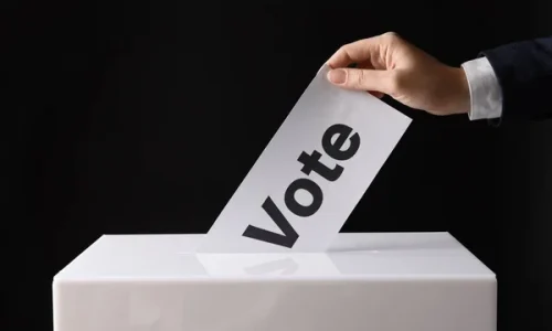 depositphotos_238146696-stock-photo-woman-putting-her-vote-ballot