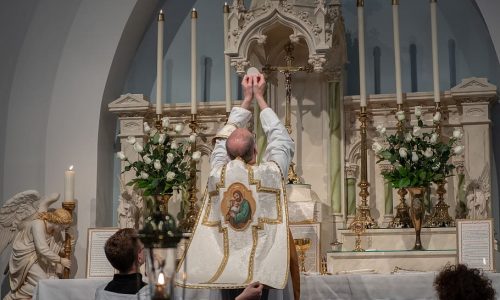 priest-standing-beside-altar