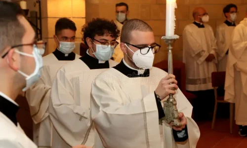 priests-wear-surgical-masks-due-to-covid-pandemic-mass-catholic-church-priests-mass-catholic-church-206952388