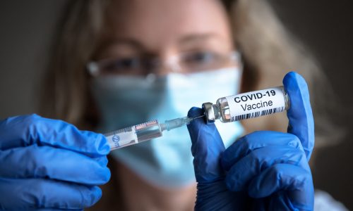 Covid-19,Vaccine,In,Researcher,Hands,,Female,Doctor's,Holds,Syringe,And