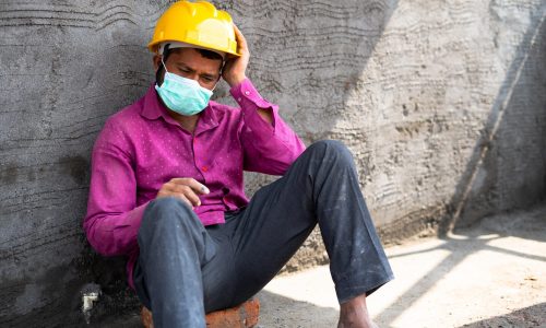 Hand,Held,Pan,Shot,Of,Worried,Construction,Labour,With,Medical
