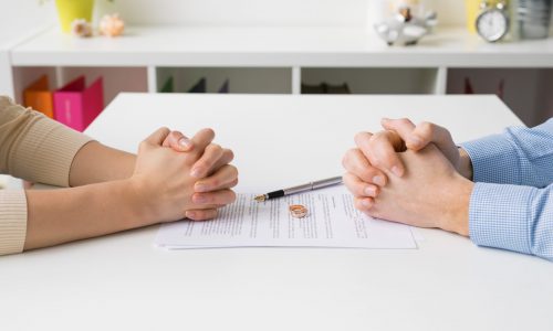 Couple,Going,Through,Divorce,Signing,Papers